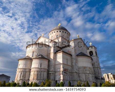 Podgorica Montenegro: Cathedral of the Resurrection of Christ under beautiful blue sky with white clouds. Property of Serbian Orthodox Church is disputed by the new religion law, causing mass protests Royalty-Free Stock Photo #1659754093