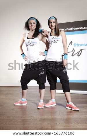 Two ladies exercising fitness