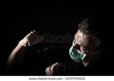 Portrait of  sick caucasian man with medical mask. Coronavirus Covid-19 concept. Black background