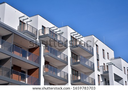 New building condominium. Modern apartment complex exterior. Royalty-Free Stock Photo #1659783703