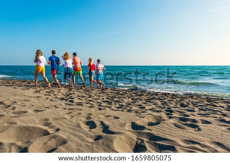 Summer holidays on the beach with friends
