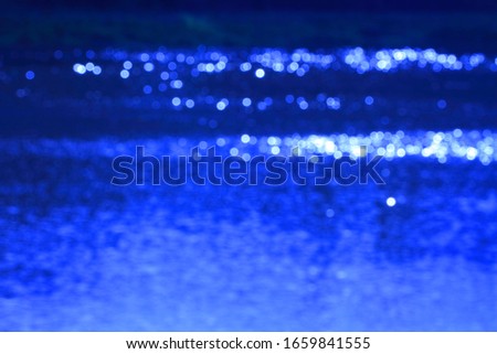 Abstract blue background with bokeh effect. Wallpaper for design.