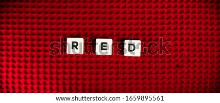 White wood tiles letters expelling red