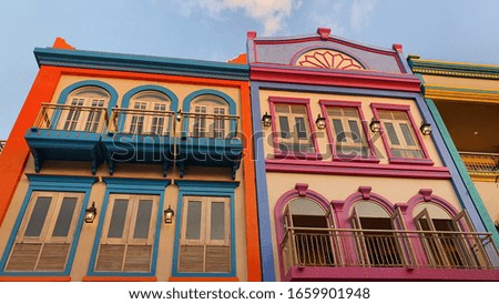 Colorful building facade under the bluesky. Architecture. Mobile photography. Decoration. Windows.