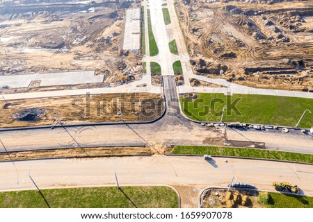 aerial top down view of road construction site at suburb area. construction of road junction