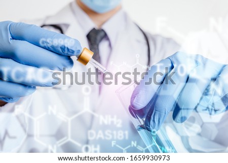 Doctor and Virus vaccine to resistance the Coivd-19 disease. Royalty-Free Stock Photo #1659930973