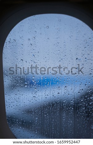rainy plane window bad weather