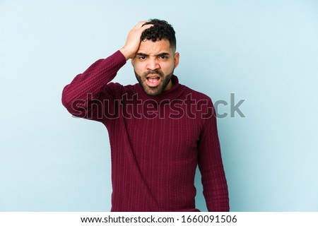 Young mixed race arabic man isolated tired and very sleepy keeping hand on head.