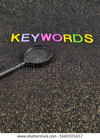 Keywords research, Search Engine Optimization, word on black background composed from colorful alphabet block wooden letters
