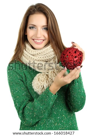 Beautiful smiling girl with Christmas toy isolated on white