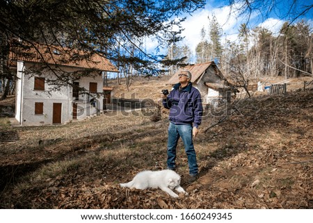 Man playing with the dog in the countryside