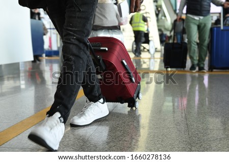 people with suitcases at the airport Royalty-Free Stock Photo #1660278136
