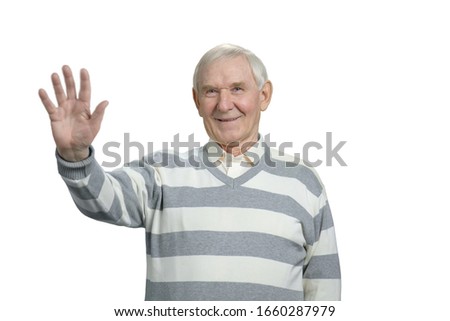 Senior man with stop gesture. Old grandfather shows palm in white isolated background.