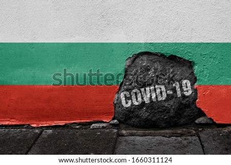 Flag of Bulgaria on the wall with cracked stone with Coronavirus name on it. 2019 - 2020 Novel Coronavirus (2019-nCoV) concept, for an outbreak occurs in Bulgaria.