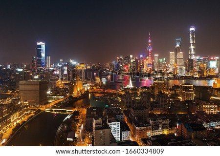 Shanghai Pudong aerial night view from above with city skyline and skyscrapers in China.