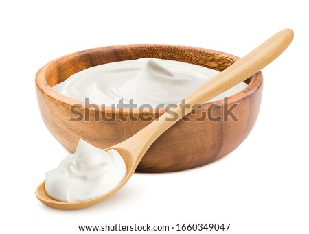 sour cream in wooden bowl and spoon, mayonnaise, yogurt, isolated on white background, clipping path, full depth of field Royalty-Free Stock Photo #1660349047