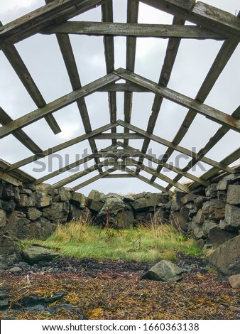 Boat house in Iceland old structure in West fjords roof blown away