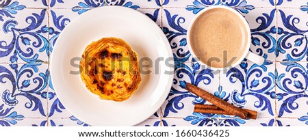 Egg tart, traditional Portuguese dessert, pastel de nata. Azulejo tile background.
