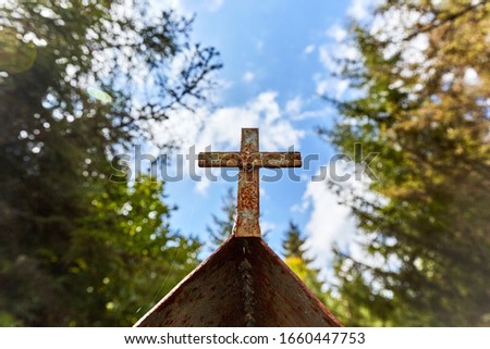 cross on a background of sky and road in Georgia