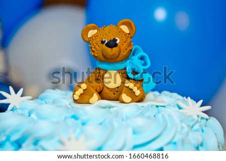 Birthday cake on teddy theme background. Candy Bar is decorated with a delicious sweet buffet with muffins and other desserts. Happy birthday concept.