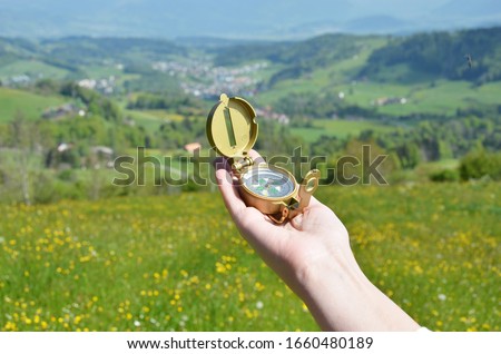 Traveler holding compass in the hand 