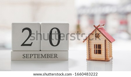 September calendar and toy home. Day 20 of month. Card message for print or remember