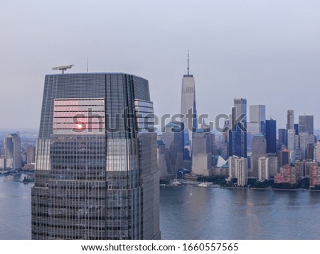 Jersey City Goldman Sachs with New York skyline in sunset, aerial photography