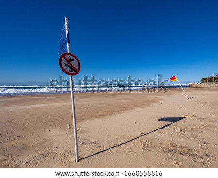 sign on beach for no surfing
