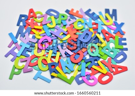 
wooden letters stacked of different colors