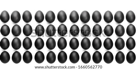 Pattern of black easter eggs on white background. Easter minimalistic concept