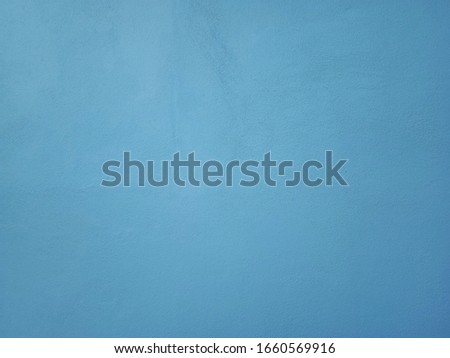 Smooth surface blue cement wall background in vintage style for graphic design or wallpaper Royalty-Free Stock Photo #1660569916