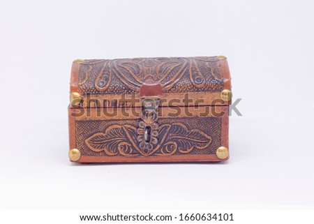 Colombian wood chest in a white background  Royalty-Free Stock Photo #1660634101