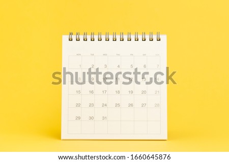Clean desktop calendar with date 31 days on solid yellow background using as schedule planning, deadline to launch project or events and holiday reminder.