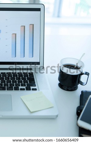 Computer and coffee on desk