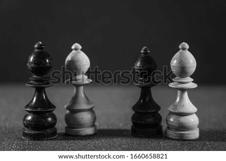 Image of Chess Pieces on Board for Game; black and white style