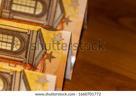 A close-up shot of several 50 (fifty) euro banknotes 