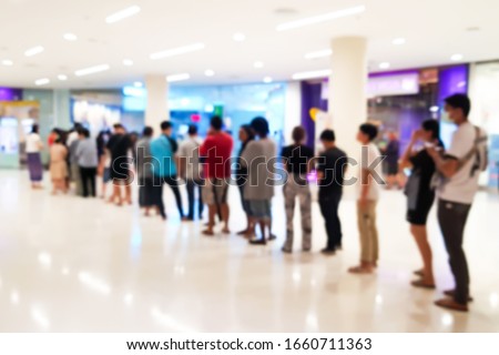 Blurred images of A lot of people queued in the mall. Royalty-Free Stock Photo #1660711363