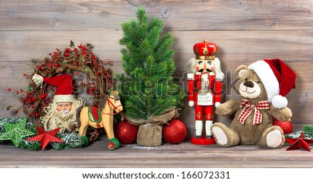 nostalgic christmas decoration with antique toys teddy bear and nutcracker. retro style picture