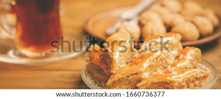 Baklava with nuts on a wooden background. Selective focus. food and drink.