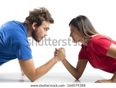 Arm wrestling challenge between a young couple