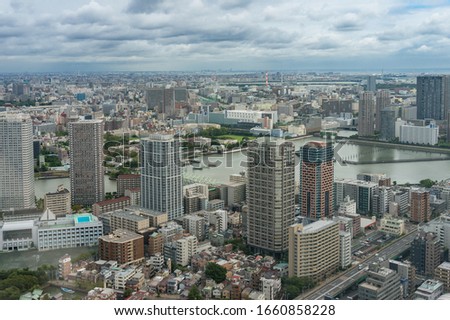 Tokyo cityscape aerial drone shot with skyscrapers and river. Japan cityscape 