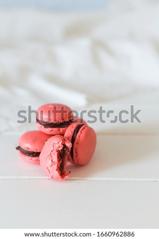 Macaron Dessert. Colorful Macaroons Flying. French Dessert In Motion Falling On Blue Background. High Resolution