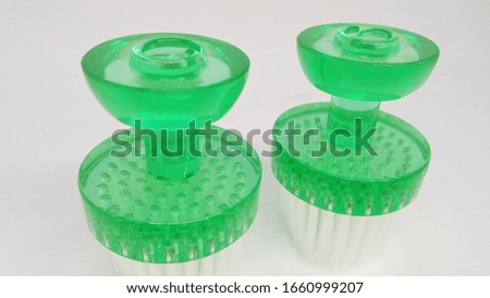 green facial brush isolated on white background. facial brush for face cleanser and beauty skin.