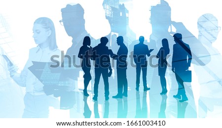 Communication and teamwork concept. Silhouettes of business people working together in abstract city. Toned image double exposure