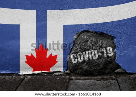 Flag of Toronto on the wall with cracked stone with Coronavirus name on it. 2019 - 2020 Novel Coronavirus (2019-nCoV) concept, for an outbreak occurs in the city of Toronto, Canada.