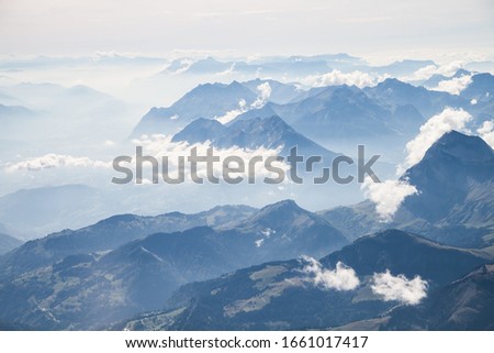 Altitude View over the Alps Moutains Chain from a Twoseater Plane Royalty-Free Stock Photo #1661017417