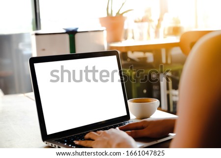 Close up of woman using cell laptop,sending massages on the garden.having sunbath.Phone with black screen,texting,video calls,