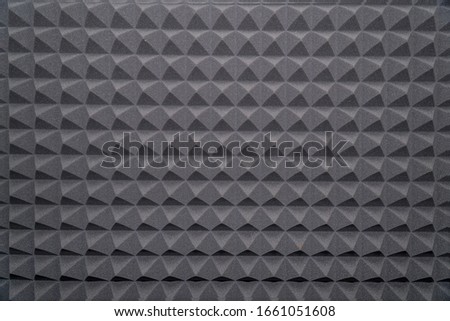 Soundproofing foam rubber texture with convex triangles in studio