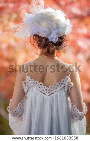 Beautiful young asian woman in white dress outdoors