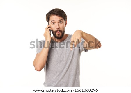 A man talks on the phone to provide technology services